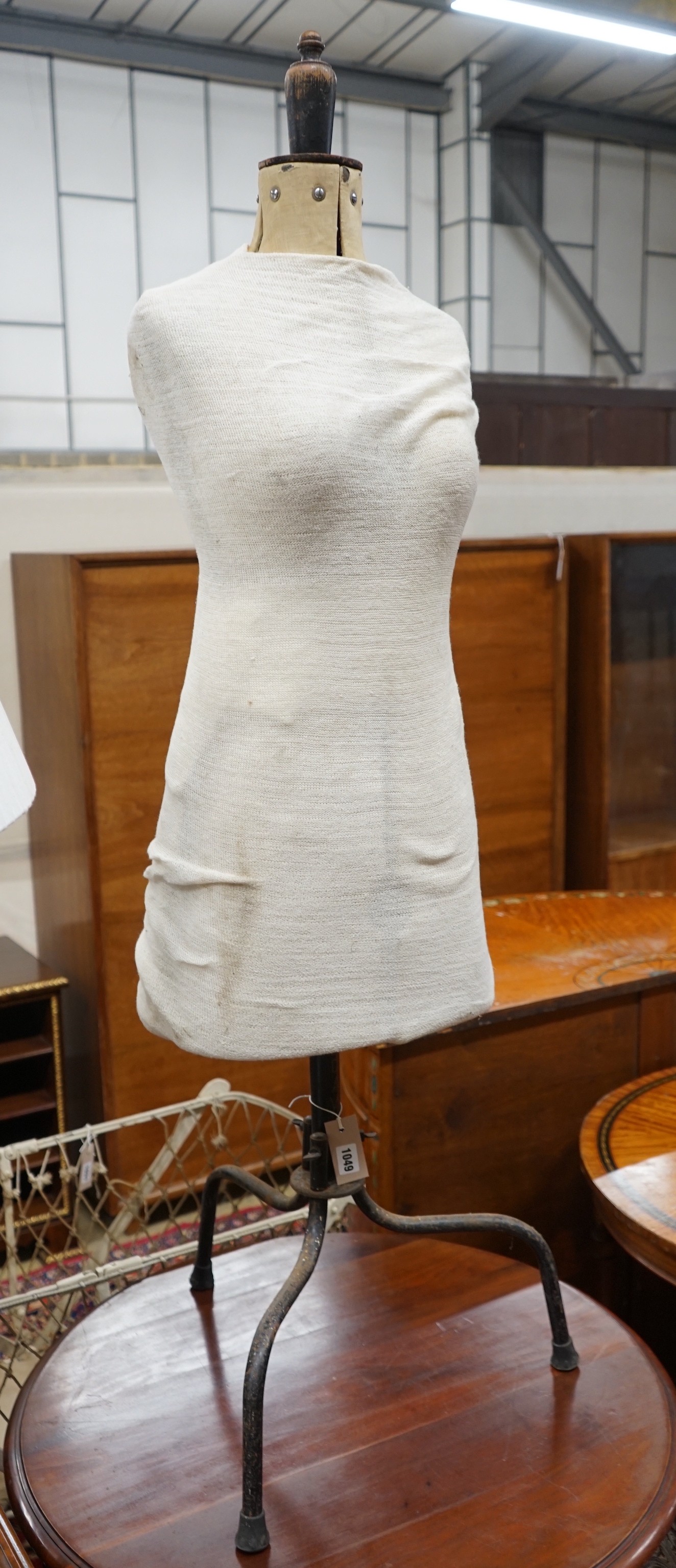 A tailor's dummy, marked 'Child' on wrought iron tripod stand, height 138cm